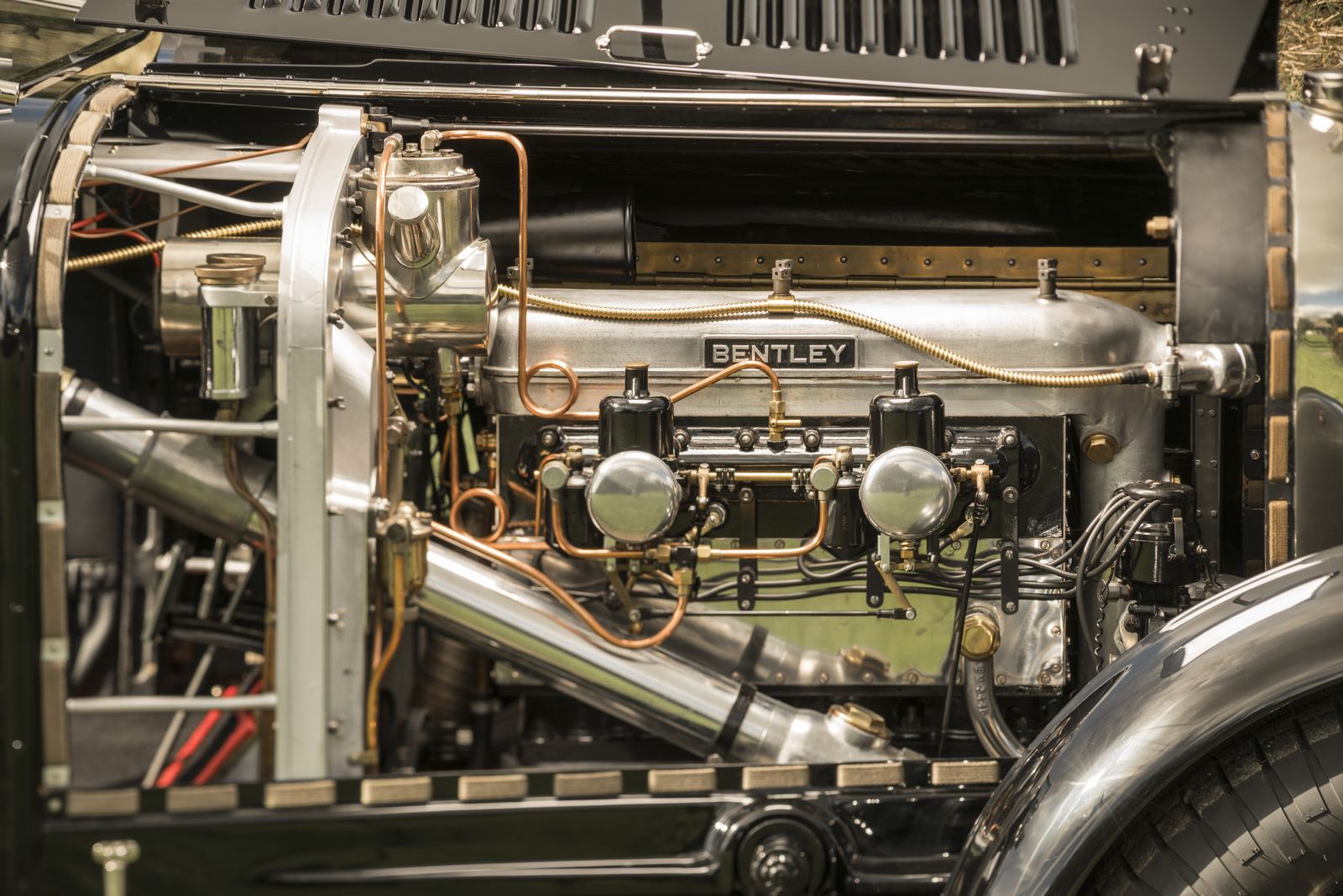 The 5.3 litre engine in sunlight, polished alloy with copper and brass fittings
